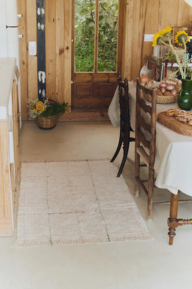 Washable Area Rug Color Lines by Lorena Canals shown at scale in a nursery