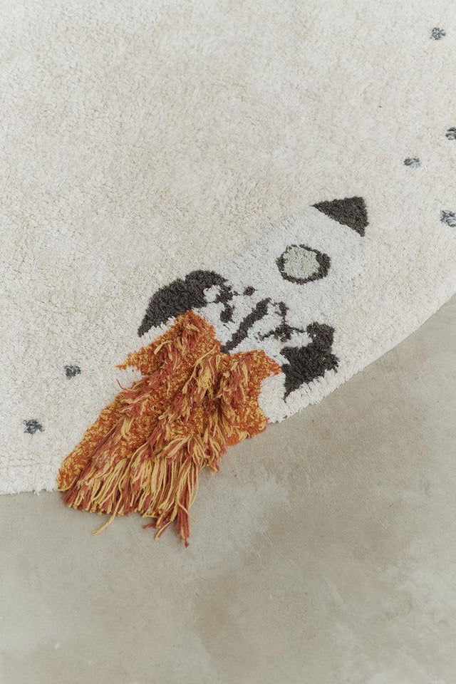 Close-up detail of Washable Cotton Rug Interstellar Journey's illustrated scene by Lorena Canals