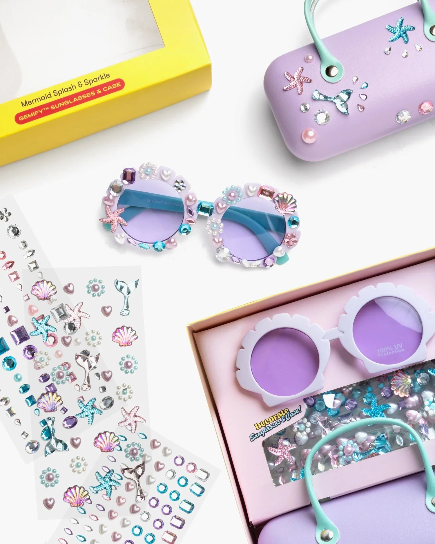 Supersmalls Mermaid Splash & Sparkle Gemify Sunglasses and Case — lavender round kids sunglasses with mermaid sparkly case and gem stickers, flat lay on yellow background