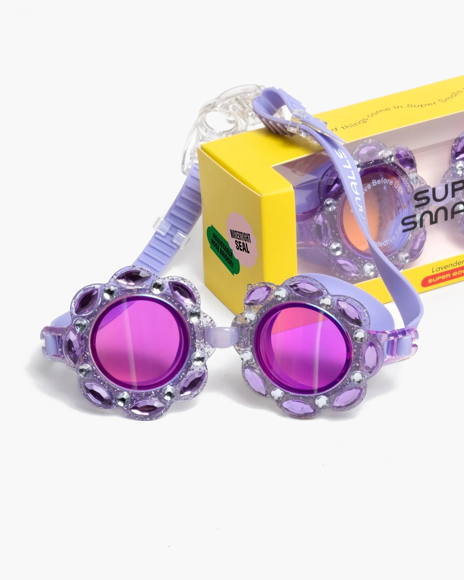 Supersmalls Lavender Haze Super Goggles — oversized purple floral kids goggles shown with accessories on yellow background
