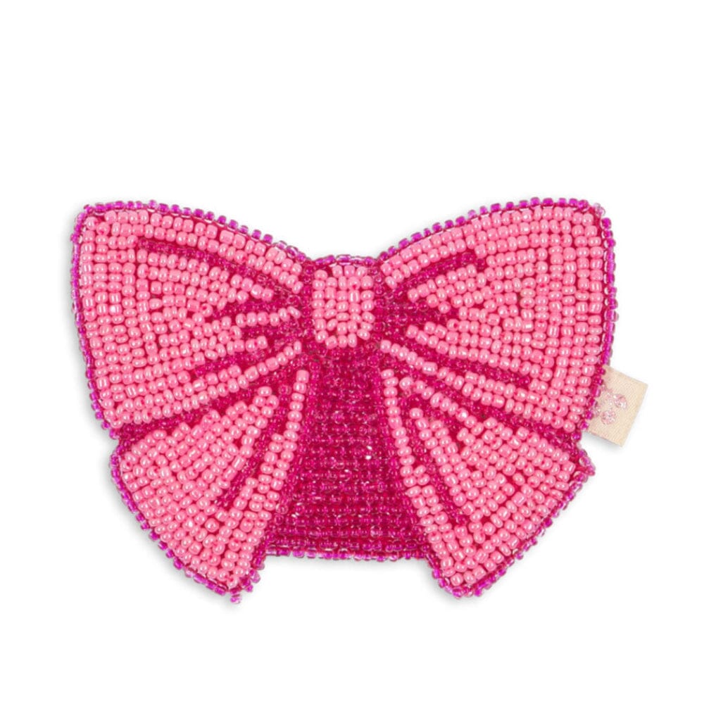 Konges Sløjd Beaded Bow Wallet — pink bow-shaped kids wallet with hand-sewn bead embellishment, flat lay on white background