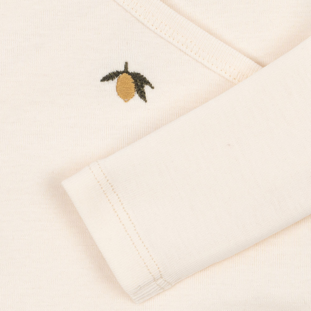 Konges Sløjd Take-Me-Home Set Antique White — close-up of wrap cardigan detail