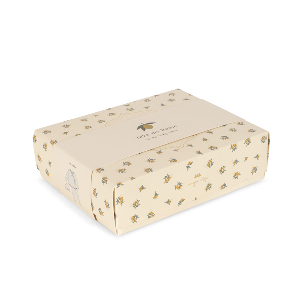 Konges Sløjd Take-Me-Home Set Antique White — lifestyle shot of baby wearing set
