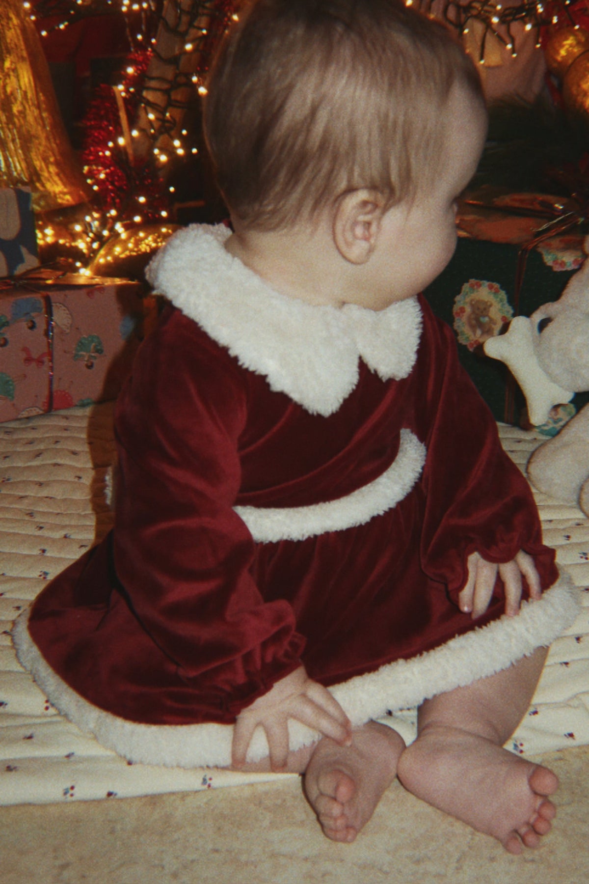 Baby wearing Konges Sløjd Christmas Romper Dress in Red Dahlia