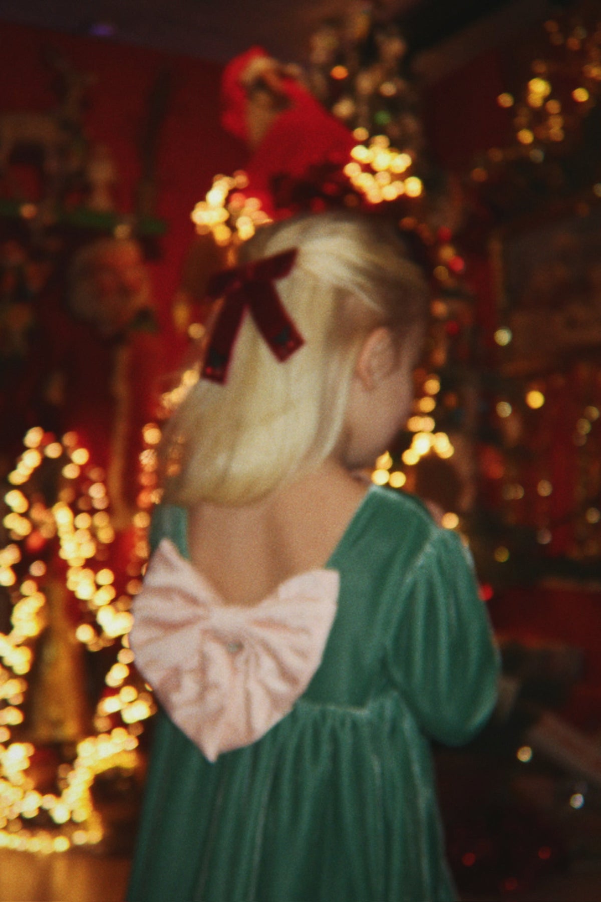 Girl wearing Konges Sløjd Gia Bow Dress in Fir