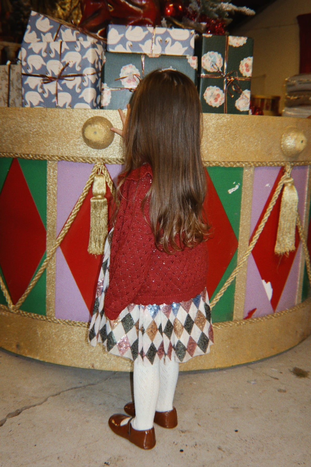 Konges Sløjd Holiday Cardigan in Red Dahlia, lifestyle image worn by child