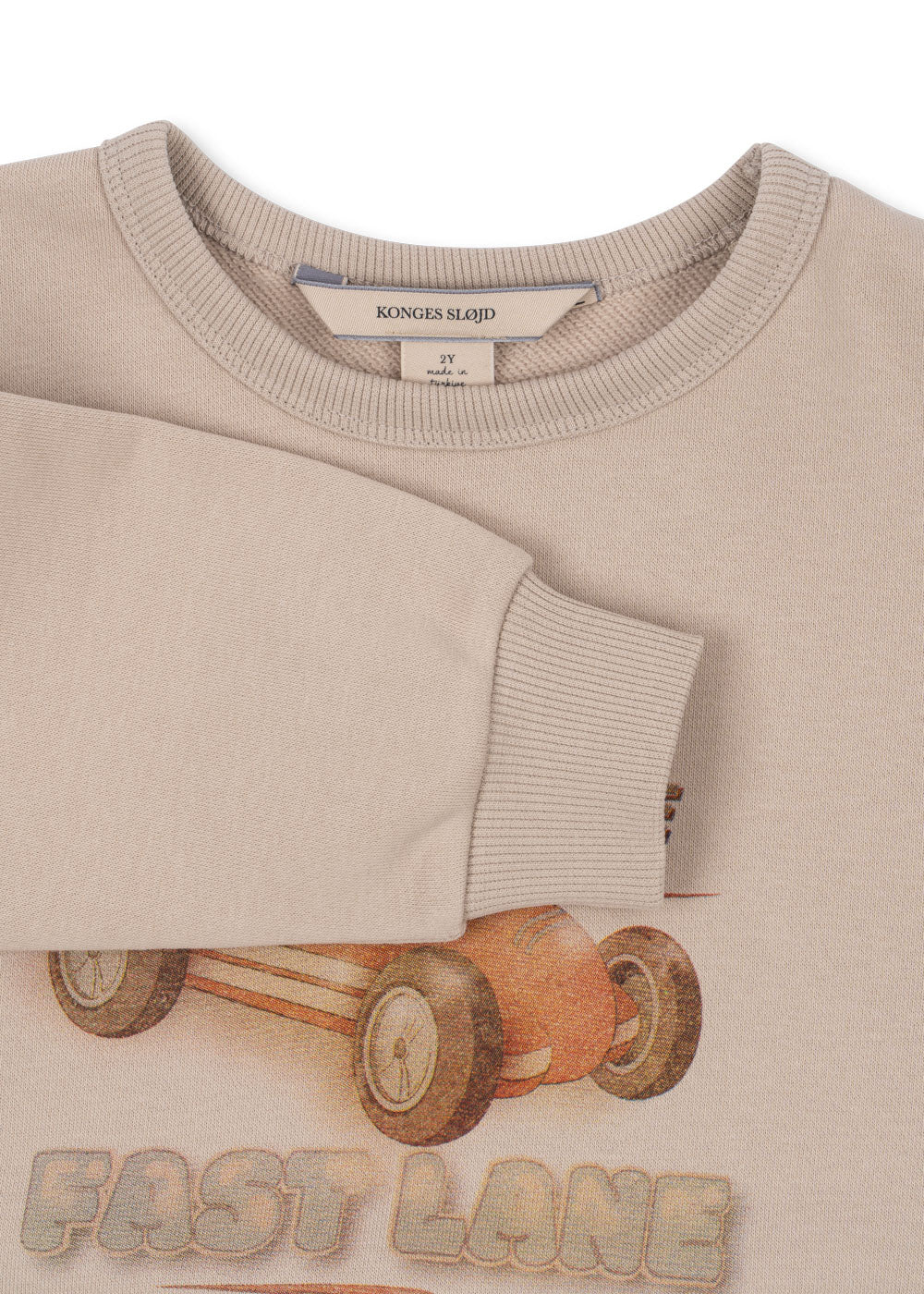 Close-up of ribbed cuff and soft fabric on Konges Sløjd Lou sweatshirt in French Oak