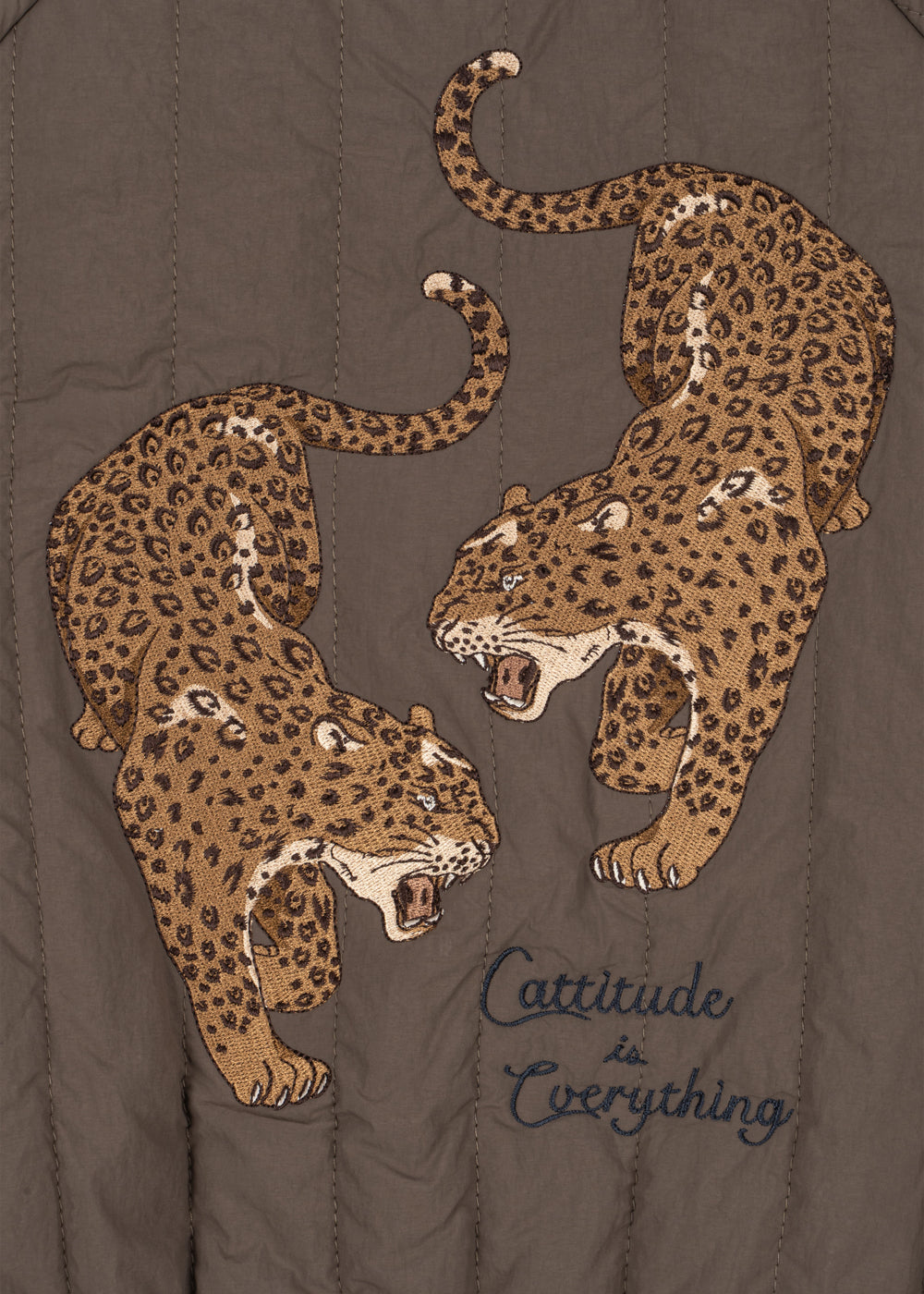 Close-up of the two embroidered leopards and Cattitude is Everything script on the back