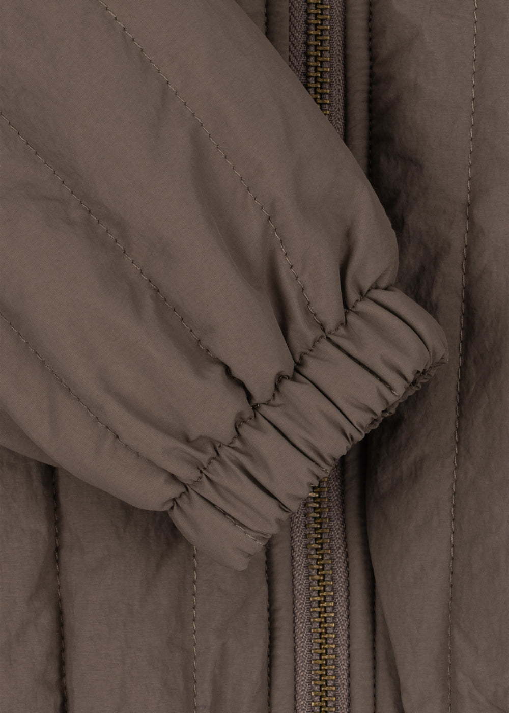 Close-up of the elasticated sleeve cuff on the quilted bomber