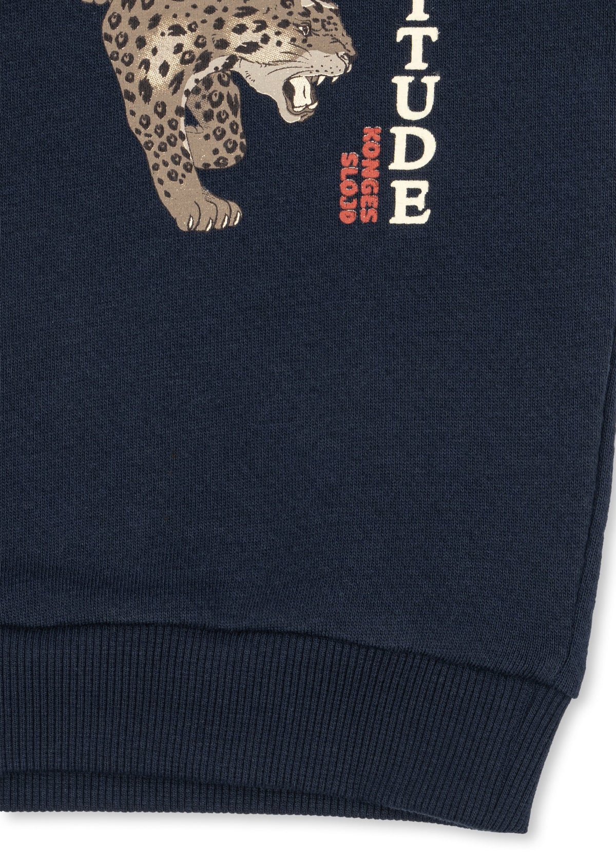 Close-up of the leopard and Cattitude lettering at the sweatshirt hem