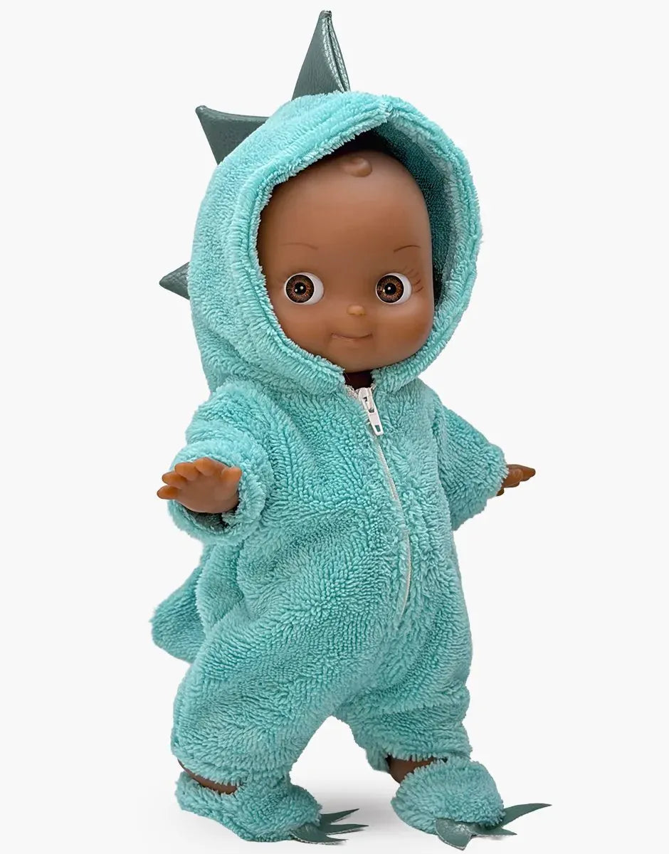 Arsène Mini Pancha doll in green dinosaur jumpsuit by Minikane