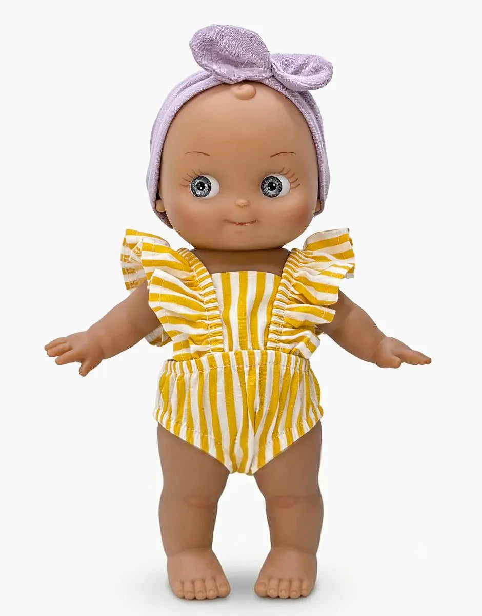 Maïa Mini Pancha doll in violet and yellow stripe beach set by Minikane