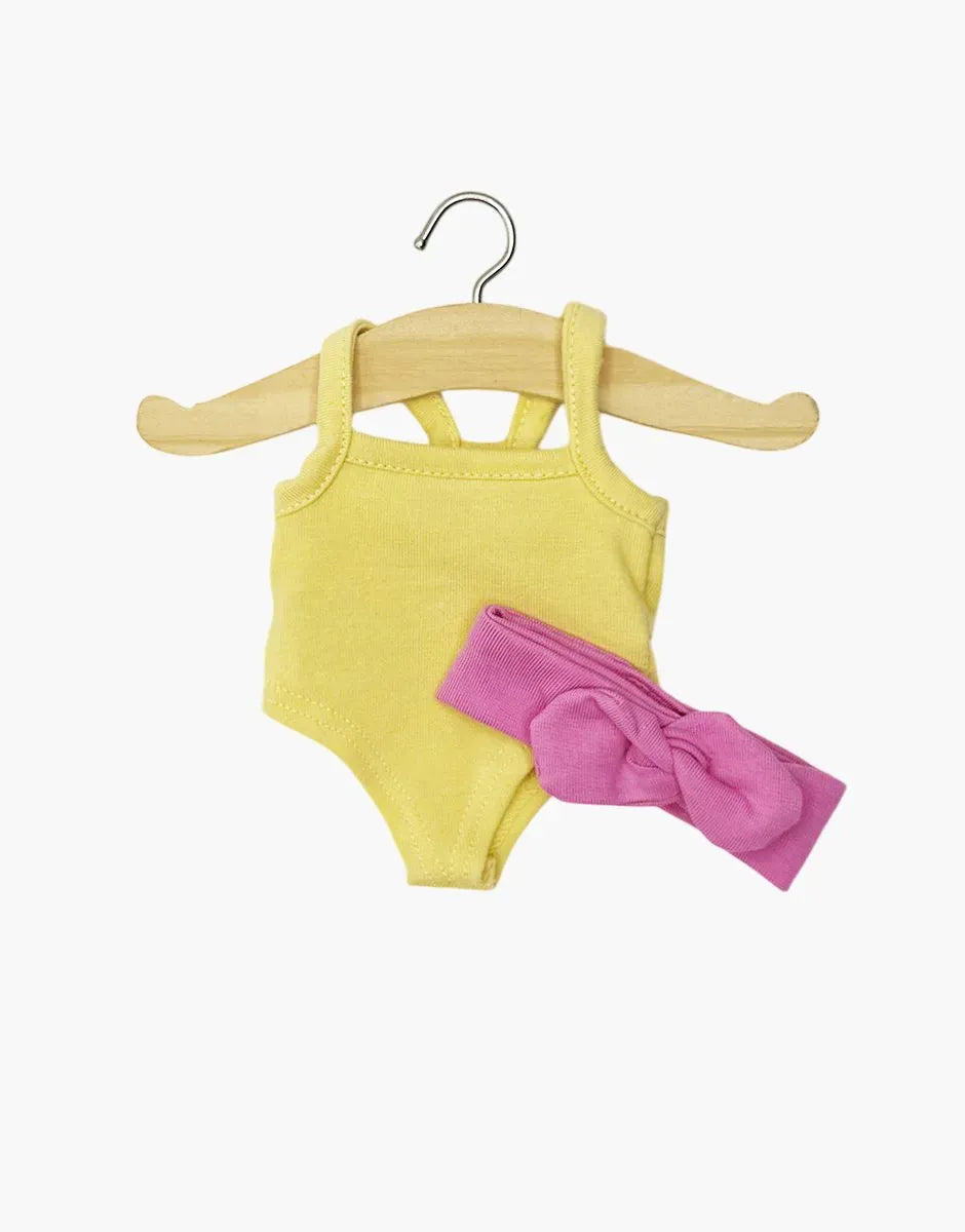 Mini Panchas vanilla yellow bodysuit with candy pink headband by Minikane