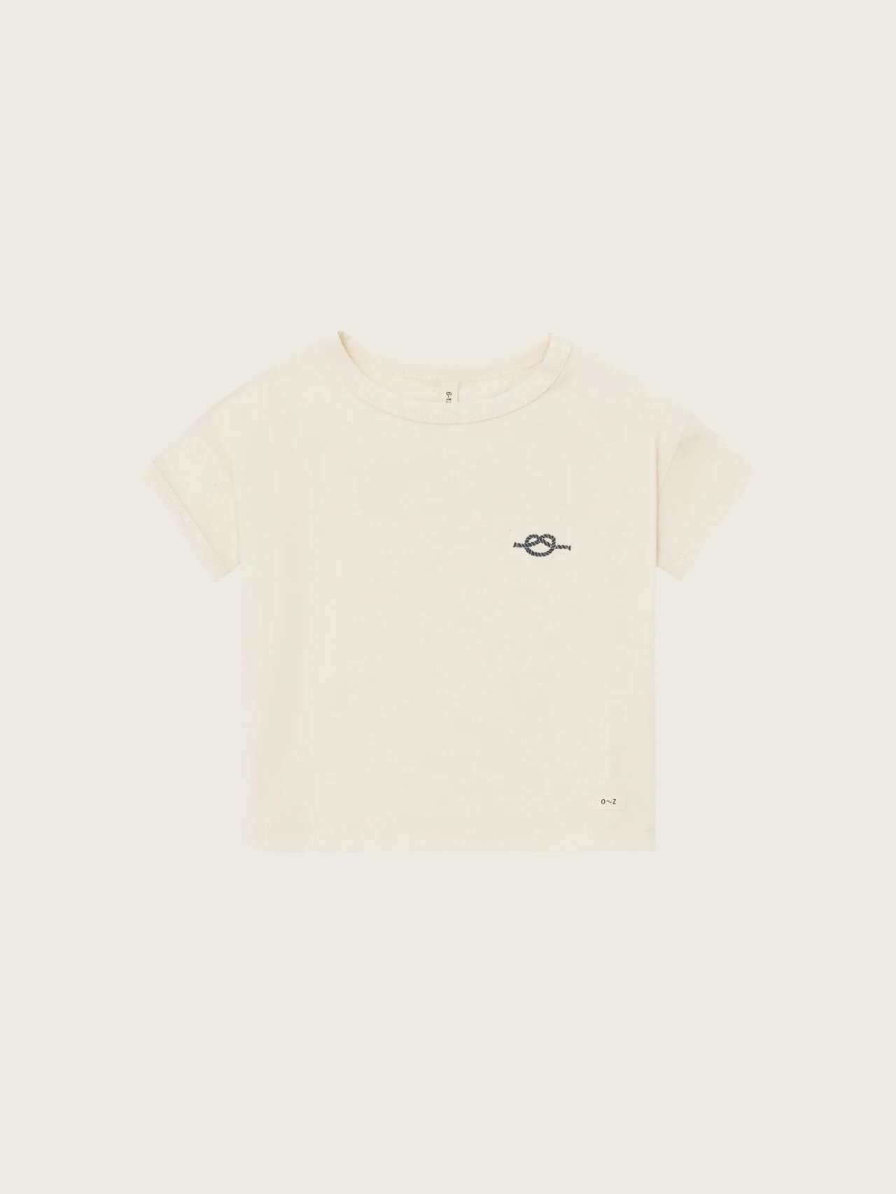 Organic Zoo Crew Boxy T-Shirt — off-white relaxed boxy organic cotton kids tee with Crew lettering, flat lay on cream background