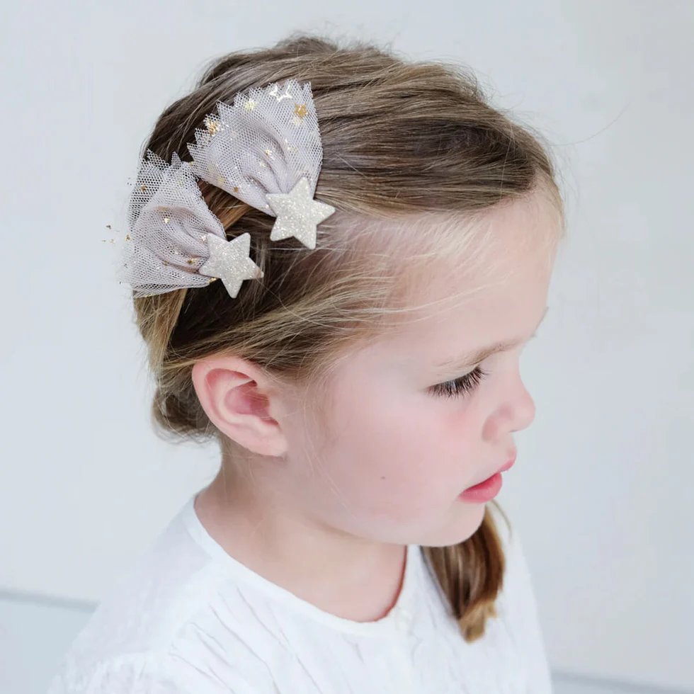Mimi & Lula star hair clips worn by girl